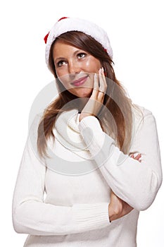 Attractive woman wearing a festive red Santa hat