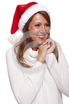 Attractive woman wearing a festive red Santa hat