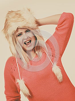 Attractive woman wearing furry winter hat