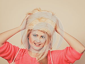 Attractive woman wearing furry winter hat