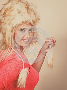 Attractive woman wearing furry winter hat