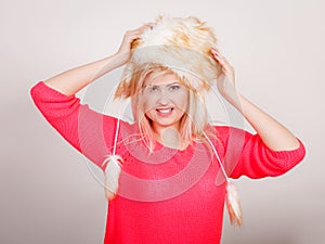 Attractive woman wearing furry winter hat