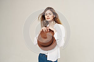 attractive woman wearing hat decoration posing modern style light background