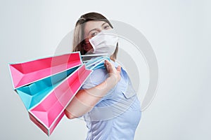 Attractive woman wearing protective mask isolated over white background