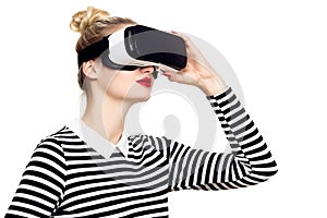 Attractive woman wearing virtual reality glasses. VR headset. VR concept on white background.