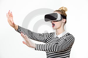 Attractive woman wearing virtual reality goggles. VR headset.