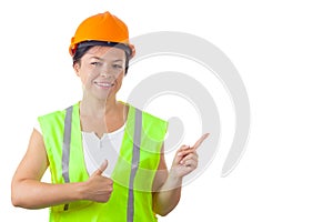 Attractive Woman Worker in Safety Jacket and Yellow Helmet