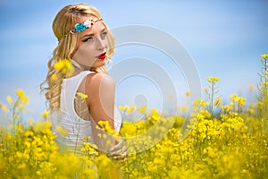 Attractive woman in yellow field