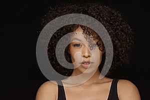 Attractive young African American woman with curly natural hair