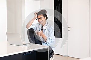 Attractive young african woman working on laptop computer