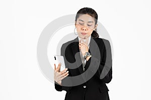Attractive young Asian business woman holding mobile smart phone over white isolated background. Social network, Internet Of