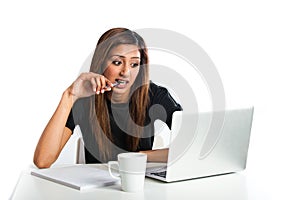 Attractive young asian indian teenage woman studying with laptop