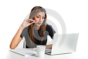 Attractive young asian indian teenage woman studying with laptop