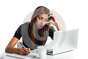 Attractive young asian indian teenage woman studying with laptop