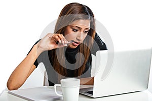 Attractive young asian indian teenage woman studying with laptop