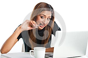 Attractive young asian indian teenage woman studying with laptop
