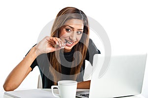 Attractive young asian indian teenage woman studying with laptop