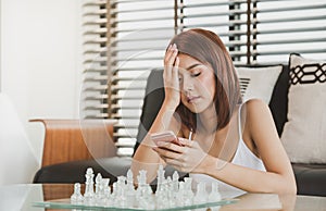 Attractive Young asian woman using a smart phone and texting