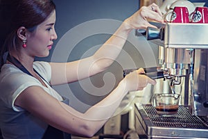 Attractive young beautiful caucasian barista in coffee shop