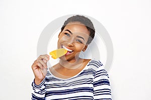 Attractive young black woman eating ice cream