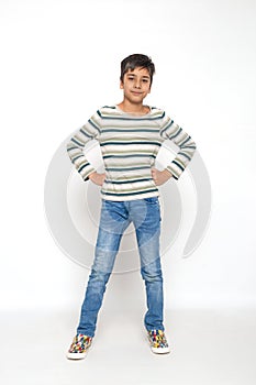 Attractive young boy aganst white background in studio