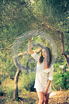 Attractive, young brunette on the beach
