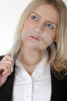 Attractive young business woman thinking