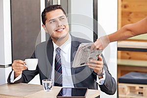 Attractive young businessman is resting in