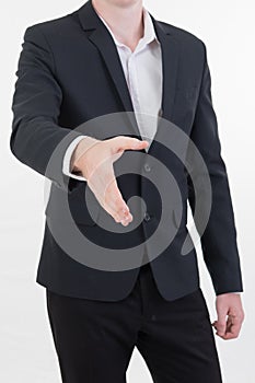 Attractive young businessman standing and giving his hand for ha