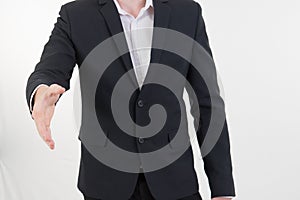 Attractive young businessman standing and giving his hand for ha