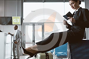 attractive young businessman waiting for flight