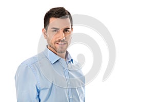 Attractive young businessman wearing blue shirt isolated over white background.