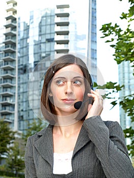 Attractive young businesswoman with headset