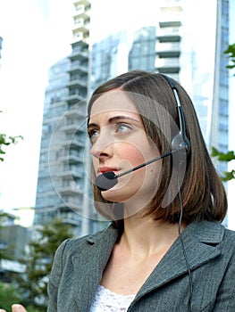 Attractive young businesswoman with headset