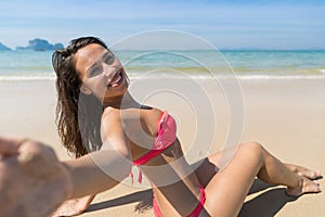 Attractive Young Caucasian Woman In Swimsuit Sitting On Beach, Girl Taking Selfie Photo Blue Sea Water Holiday