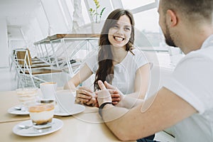 Attractive young couple on a date in a cafe