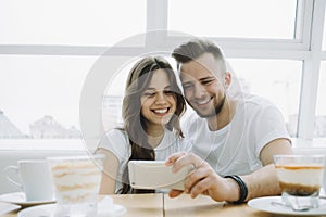 Attractive young couple on a date in a cafe