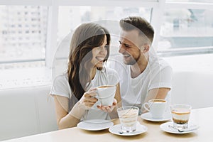 Attractive young couple on a date in a cafe