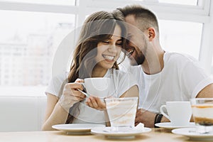 Attractive young couple on a date in a cafe