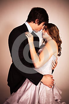 Attractive Young Couple Embracing For A Kiss