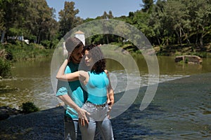 Attractive young couple in love, looking into each other's eyes, close faces about to kiss, in very sensual attitude.