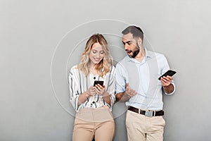 Attractive young couple standing isolated