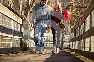 Attractive young couple walking towards the viewer