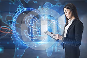 Attractive young european business woman using tablet with abstract glowing blue dollar sign and map with charts on blurry office