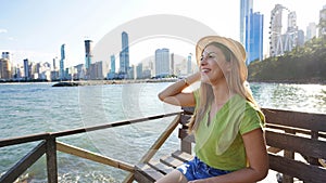 Attractive young fashion woman enjoying Balneario Camboriu city feelings. Travel in Brazil. Banner with copy space