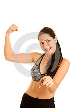 Attractive young fit woman gesture strength isolated over white