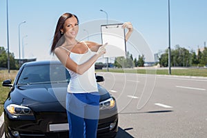 Attractive young girl is buying a new transport