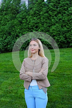 Attractive young girl smiling and posing to camera and stands on