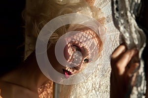 Attractive young girl waiting at the window