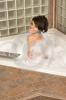 Attractive young gorges woman taking Bubble bath